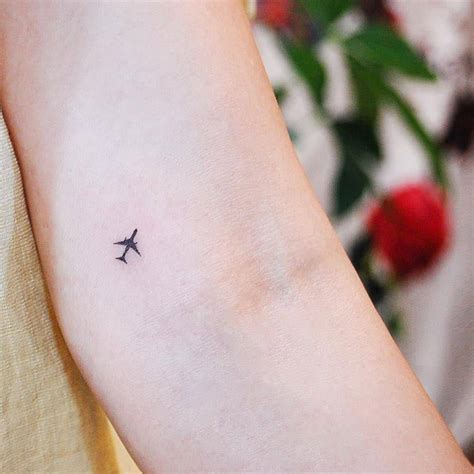 tiny airplane tattoo|minimalist airplane tattoo.